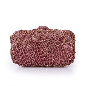 Detailed view of pink crystal rhinestones and sequins on a floral metal evening clutch bag