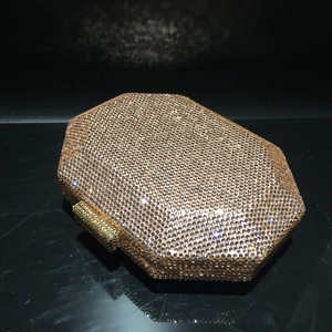 Macro detail of the champagne gold crystal encrusted octagonal evening clutch evening bag
