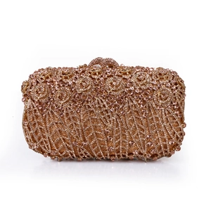Detail of rose gold evening clutch featuring 3D floral crystal pattern and rhinestones