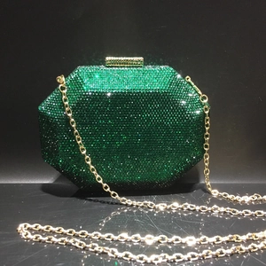 Detail view of octagon emerald crystal evening bag with gold chain and hardware