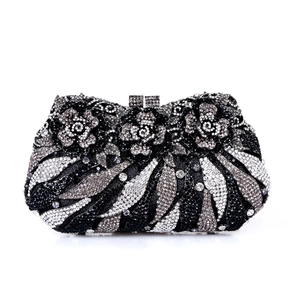 Detailed view of luxury evening clutch with handcrafted floral crystals and silver rhinestones