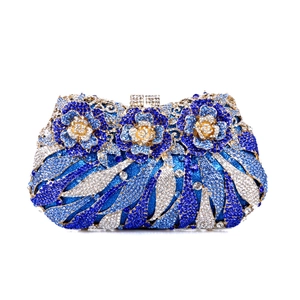 Close-up of blue crystal gradient evening clutch with 3D floral rhinestone details