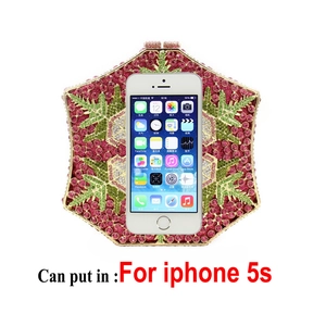 Detail of crystal floral evening clutch bag showing capacity to fit an iPhone 5s device