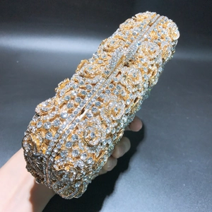 Detailed view of handmade gold flower clutch bag with sparkling crystal rhinestones