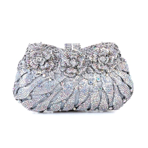 Detail of silver evening clutch with crystal flower inlay and intricate rhinestone patterns