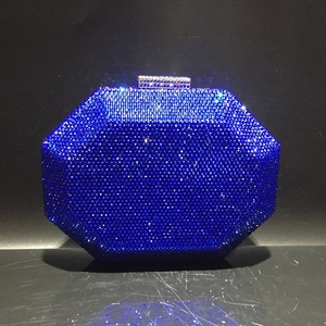 Macro detail of royal blue rhinestone clutch bag with octagonal geometric design and metal clasp