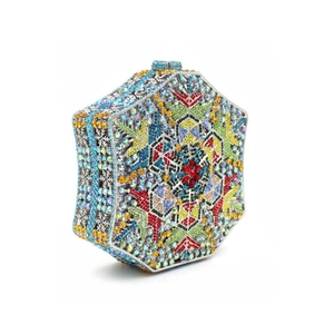 Macro shot of luxury hexagonal evening bag with colorful hand-set crystal snowflake pattern
