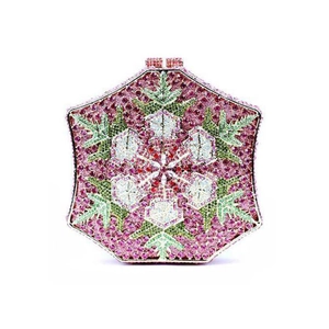 Detail of hexagonal evening clutch with pink and green rhinestone snowflake pattern