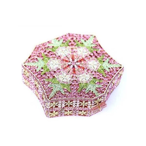 Detailed view of pink crystal snowflake clutch bag with hand-set rhinestones and floral pattern