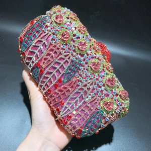 Detailed view of colorful rhinestones on a rose flower luxury evening clutch bag