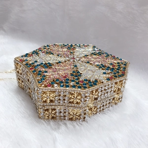 Exquisite snowflake pattern with vibrant rhinestones on luxury evening clutch bag detail