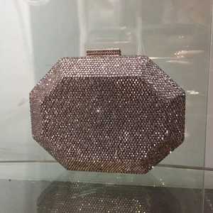 Macro detail of octagonal evening clutch with grey rhinestones and sparkling crystal clasp
