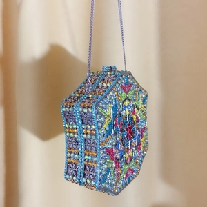 Detailed macro view of the hexagonal evening clutch with multicolored crystal rhinestones