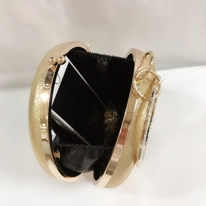 Elegant gold round PU leather evening clutch with rhinestone ring handle and internal storage