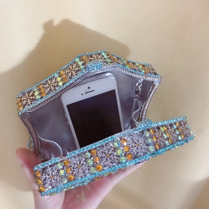 Internal view of snowflake crystal evening bag showing capacity for a smartphone