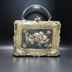Vintage evening handbag with gold floral frame and luxury rhinestone flower decor