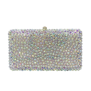 Macro view of crystal rhinestones and diamond clasp on a luxury evening clutch bag