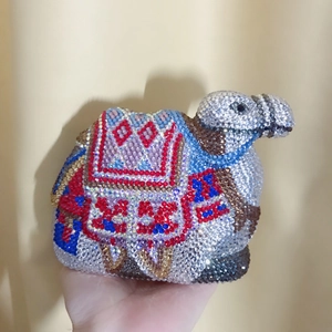Detail of camel-shaped evening bag with colorful hand-set rhinestones and crystals
