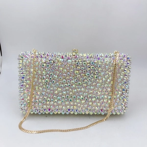 Detailed close-up of rainbow crystal rhinestones on a rectangular evening clutch bag
