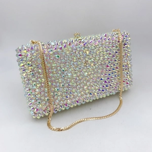 Macro detail of luxury rectangular evening clutch with iridescent rhinestones and gold chain