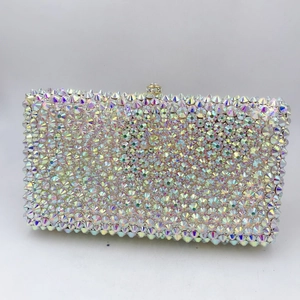Macro detail of rectangle evening bag featuring rainbow AB rhinestones and metal clasp