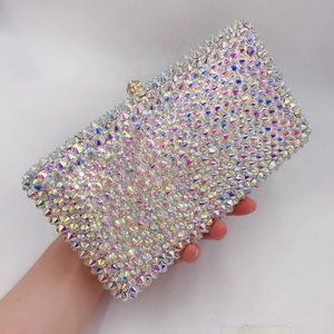 Detailed close-up of rainbow crystal rhinestones on a square luxury evening clutch bag