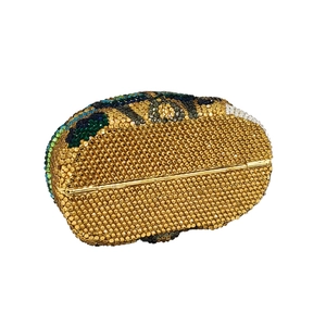 Detail of camel shaped evening clutch bag featuring handmade gold crystals and colorful rhinestones