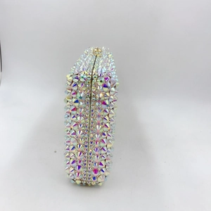 Detail of luxury evening clutch with rainbow crystals and gold metallic frame closure