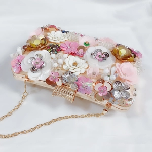 Detail of floral evening bag with pink sequins, pearl beads and crystal metal clasp