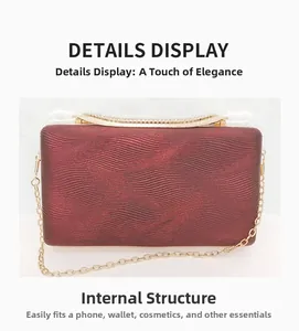 Detail view of burgundy clutch featuring wave texture, rhinestone trim and gold chain