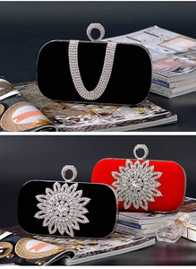 Detail view of U-shaped crystal diamonds and velvet fabric on the evening clutch bag