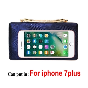 Detail showing dark blue evening clutch capacity with a smartphone for size reference
