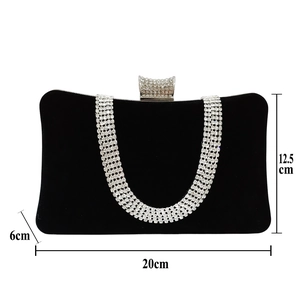 Detailed size view of black velvet evening bag with U-shaped crystal fringe and rhinestones