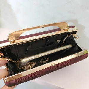 Deep red PU leather evening clutch with gold metal handle, chain, and inner phone storage