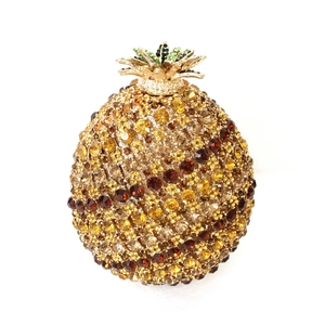 Detailed close-up of crystal pineapple evening clutch with luxury rhinestones
