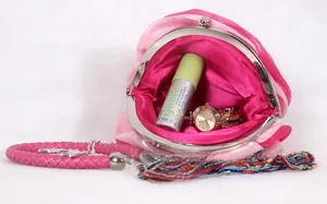 Macro view showing the interior capacity and silk rose design of the mini floral handbag