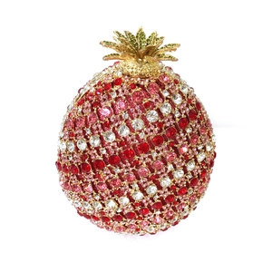 Macro shot of pineapple crystal evening bag with red and pink rhinestone pavé detail