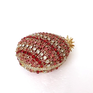 Detail of red and pink pineapple crystal evening bag with sparkling rhinestones