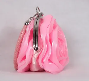 Detailed view of the pink 3D rose bridal clutch with silk petals and silver metal clasp