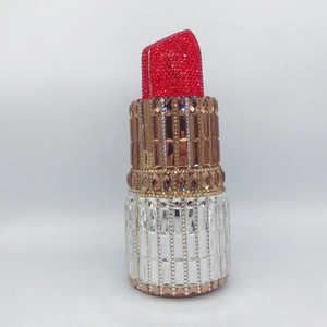 Creative lipstick-shaped evening clutch bag encrusted with sparkling red and silver rhinestones