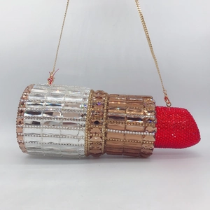 Lipstick shaped evening clutch bag with sparkling rhinestones and gold chain strap