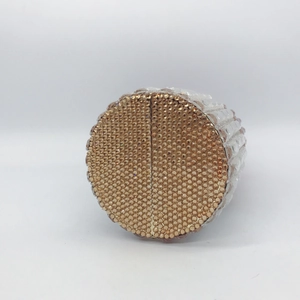 Detailed side view showing the champagne crystal rhinestones on the lipstick clutch bag