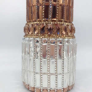 Close-up of luxury lipstick clutch bag featuring handmade amber and clear crystal inlay