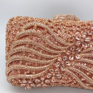 Elegant rose gold hollow out evening clutch bag with crystals and bow ribbon detail