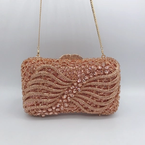 Rose gold bow evening clutch bag with crystal embellishments and metal chain strap