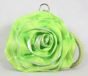 Detailed macro view of the lime green rose petal satin fabric and silver ring metal clasp
