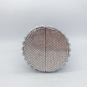 Elegant round evening clutch bag with sparkling crystals and pavé diamond detailing
