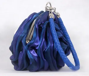 Detailed view of 3D rose satin evening bag with blue-purple gradient texture and clasp