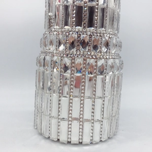 Close-up of sparkling crystals and diamonds on a luxury lipstick evening clutch bag