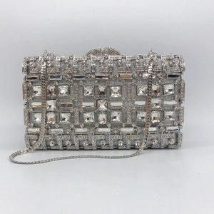 Silver rhinestone clutch bag with geometric crystal pattern and metallic chain strap